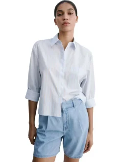 Short stone uni avec une coupe droite et des crochets en fermeture