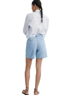 Short stone uni avec une coupe droite et des crochets en fermeture