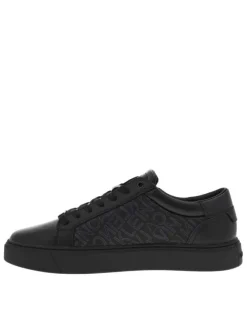 Sneakers basses en cuir noir à semelle vulcanisée, lacets et zip latéral