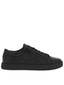 Sneakers basses en cuir noir à semelle vulcanisée, lacets et zip latéral
