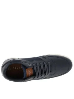 Sneakers bleu marine à talon plat avec un patch de la marque sur la languette