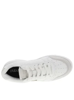 Sneakers en cuir blanc et empiècements beige à logo jaune débossé et lacets