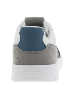 Sneakers en cuir blanc à logo siliconé jaune débossé à l'extérieur de la tige