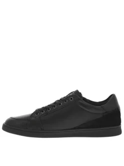 Sneakers en cuir noires plates avec fermeture zippée et lacets plats enduits