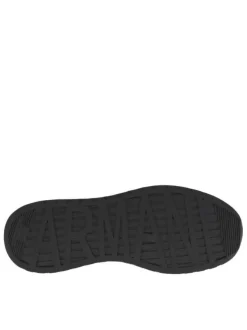 Sneakers monochromes noires à doublure néoprène, semelle semi-compensée blanche