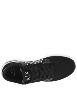Sneakers monochromes noires à doublure néoprène, semelle semi-compensée blanche
