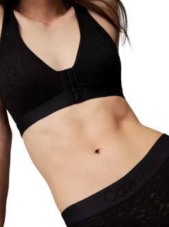 String noir en dentelle zébrée avec une ceinture élastiquée large