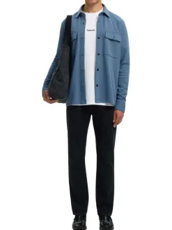 Surchemise bleue uni avec un col boutonné et des manches longues