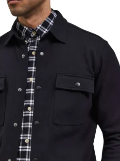 Surchemise Jackie noire en maille piquée avec coupe droite et col à revers
