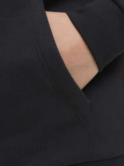 Sweat à capuche noir avec un imprimé blanc et des manches longues