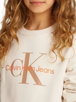 Sweat en coton beige uni avec un col rond et le nom de la marque imprimé