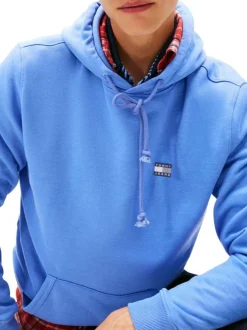 Sweat bleu uni avec une coupe droite et un col à capuche avec cordon de serrage