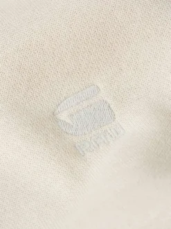 Sweat à capuche blanc uni avec une coupe droite et une poche kangourou