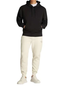 Sweat à capuche en coton noir avec une coupe droite et un imprimé au dos