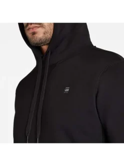 Sweat à capuche en coton noir uni avec une coupe droite et une poche