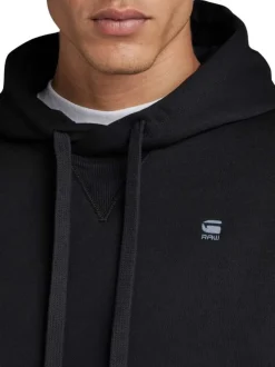 Sweat à capuche en coton noir uni avec une coupe droite et une poche