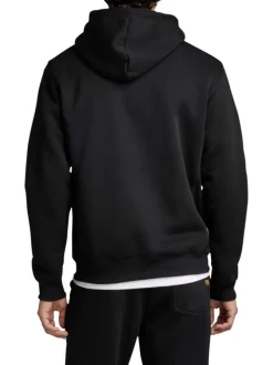 Sweat à capuche en coton noir uni avec une coupe droite et une poche