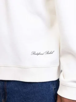 Sweat écru maille en piquée avec une coupe ample et un col polo