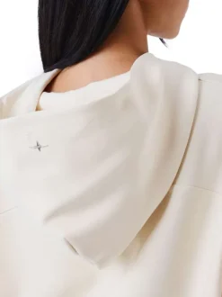 Sweat écru uni avec une coupe cropped à capuche et à manches longues
