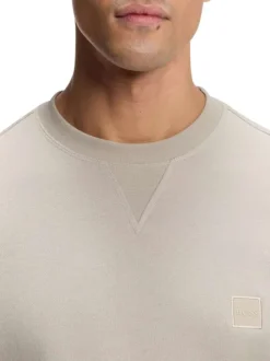 Sweat en coton beige coupe ajustée pourvu d'un col rond côtelé