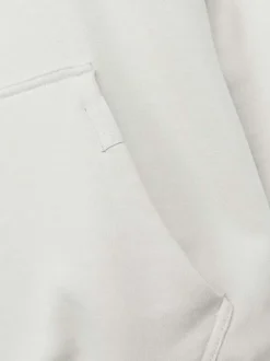Sweat en coton beige uni coupe droite avec un col à capuche et étiquette cousue