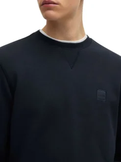 Sweat en coton marine uni avec une coupe regular fit et un patch à la poitrine
