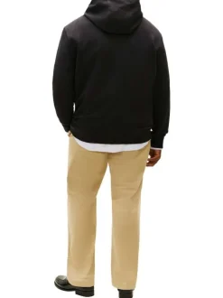 Sweat en coton noir uni avec une coupe droite et une poche kangourou