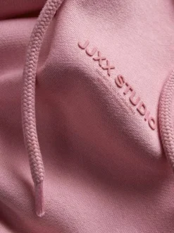 Sweat en coton rose pourvu d'un coupe droite et d'un col à capuche