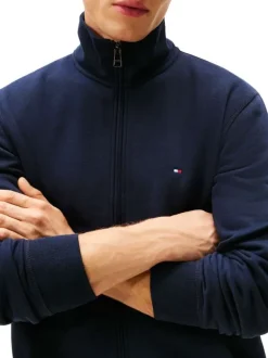 Sweat marine pourvu d'une coupe ajustée et d'un col montant zippé