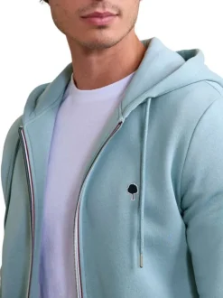 Sweat zippé ciel uni avec une coupe droite et un col à capuche