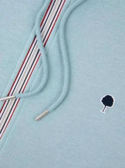 Sweat zippé ciel uni avec une coupe droite et un col à capuche