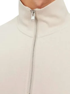 Sweat zippé écru uni avec une coupe droite et une poche kangourou