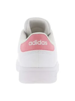 Tennis roses avec une semelle à talon plat et logos contrastés