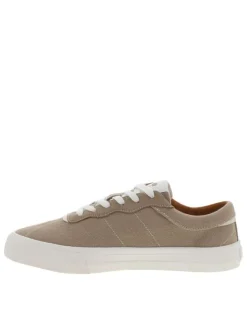 Tennis beiges avec une fermeture à lacets et des surpiqûres blanches