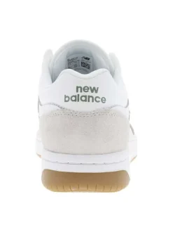 Tennis blanches à détails verts avec des lacets plats tressés