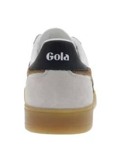 Tennis blanches et marron en cuir avec un talon plat et des lacets