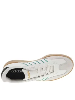 Tennis blanches et vertes en cuir à semelle marron avec logo jaune et lacets