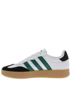 Tennis en cuir blanches avec semelle à talon plat et à lacets