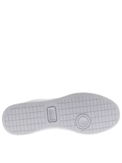 Tennis en cuir blanches et bleues avec un talon plat et des lacets