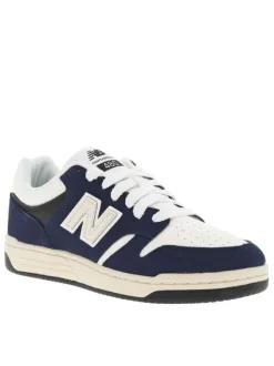 Tennis en cuir blanches et bleu marine avec semelle plate et lacets tressés