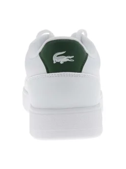 Tennis en cuir blanches et vertes avec un talon plat et des lacets