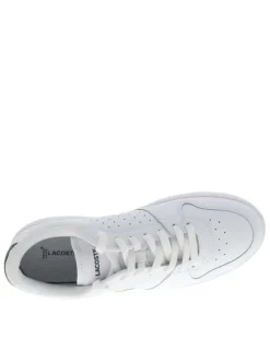 Tennis en cuir blanches et vertes avec un talon plat et des lacets