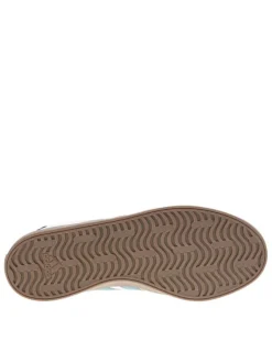 Tennis en cuir écrues avec semelle à talon plat et lacets ton sur ton