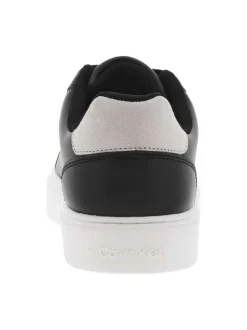Tennis en cuir noires à talon plat avec des lacets et logo blanc