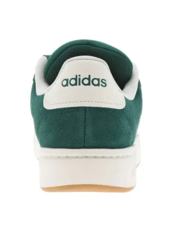 Tennis vertes et blanches à talon plat avec des lacets larges