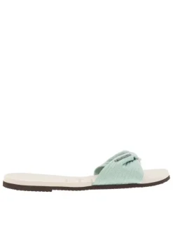 Tongs antidérapantes à entre-doigts liant la sangle beige à lurex du coup-de-pied