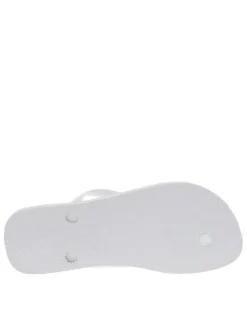 Tongs entre-doigts blanches, à détails brésiliens et semelle antidérapante
