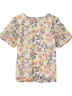 Top blanc fleuri coupe droite avec un col rond et des liserés lurex
