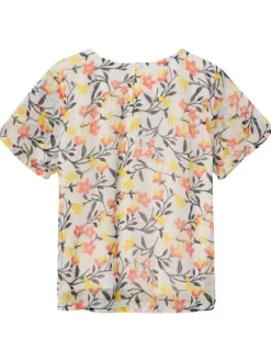 Top blanc fleuri coupe droite avec un col rond et des liserés lurex