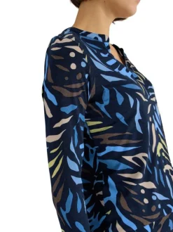 Top marine à motifs pourvu de manches longues et d'un col tunisien